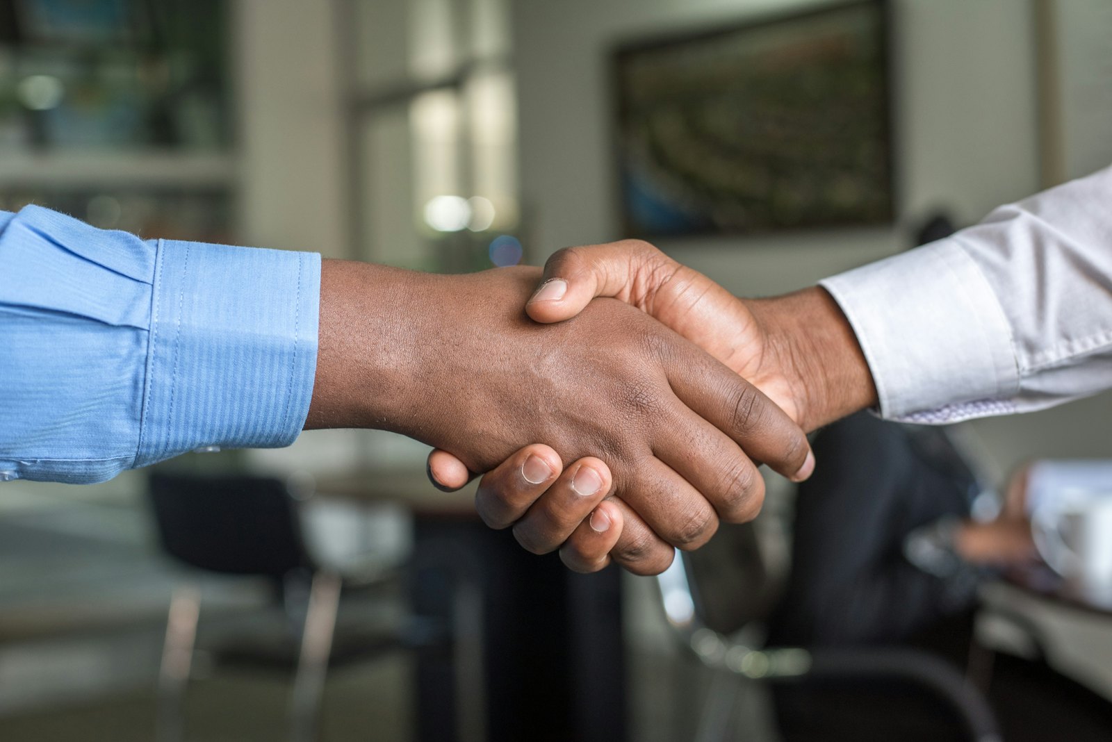 Business partners shaking hands after agreeing a supply contract